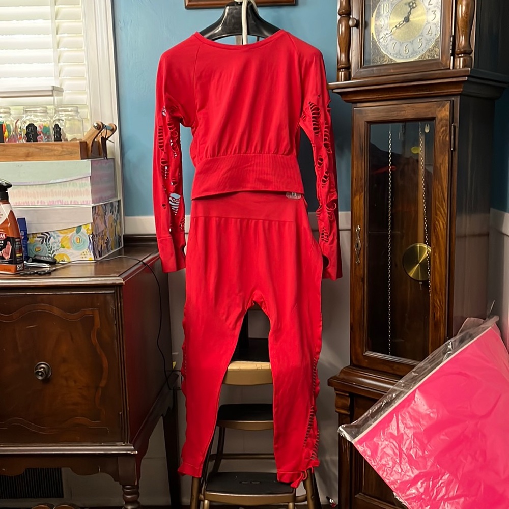 UNDER CONTROL red distressed long sleeve fitted top and matching capri leggings.